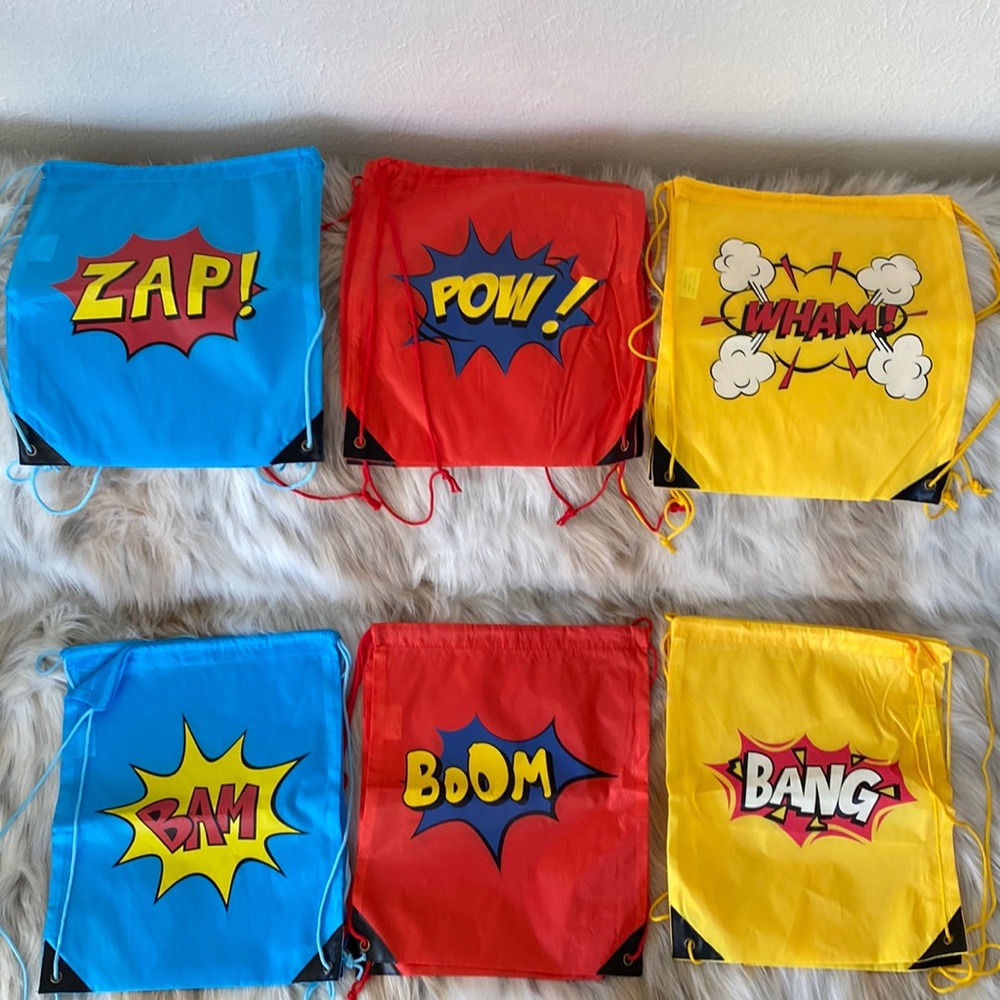 NWOT Set of 12 drawstring bags with comic book designs